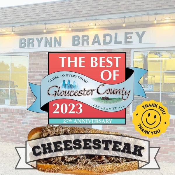 Brynn Bradley restaurant exterior with a "Best of Gloucester County 2023" award and a cheesesteak.