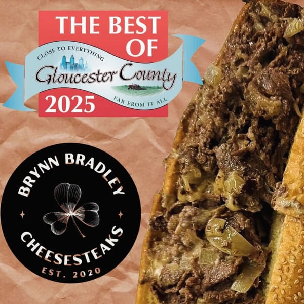 A Brynn Bradley cheesesteak with onions, alongside a "Best of Gloucester County 2025" award ribbon.